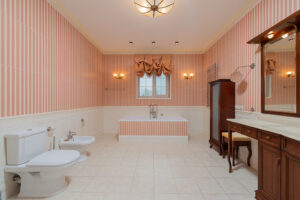 pink and white striped wallpaper bathroom